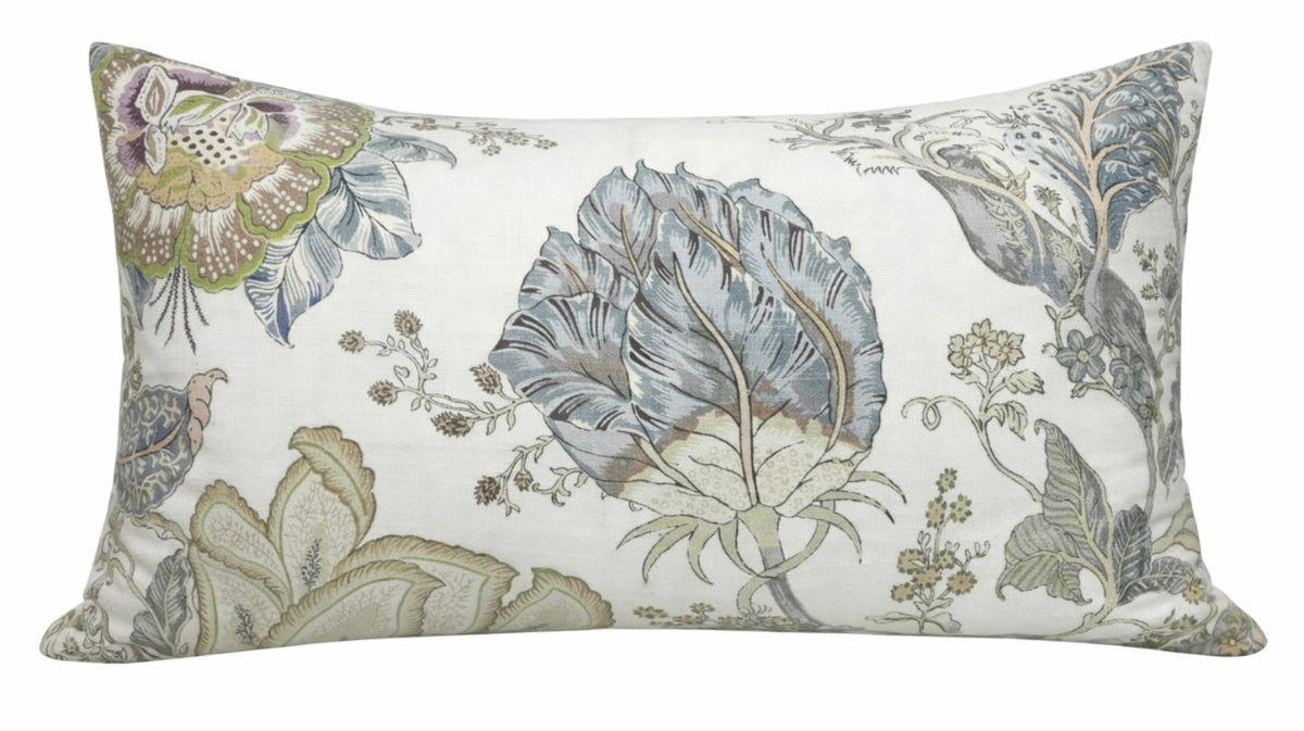 Rectangular pillow cover with aqua and muted green botanical prints on an off-white background featuring large stylized leaves and floral motifs.