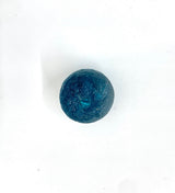 Dark teal spherical ornament with textured surface and a glossy finish, shown centered on a plain white background.