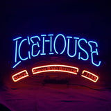 Icehouse Since Plank Road Brewery 1855 Neon Sign mounted on wall showing glowing white and warm yellow neon tubes around red lettering.