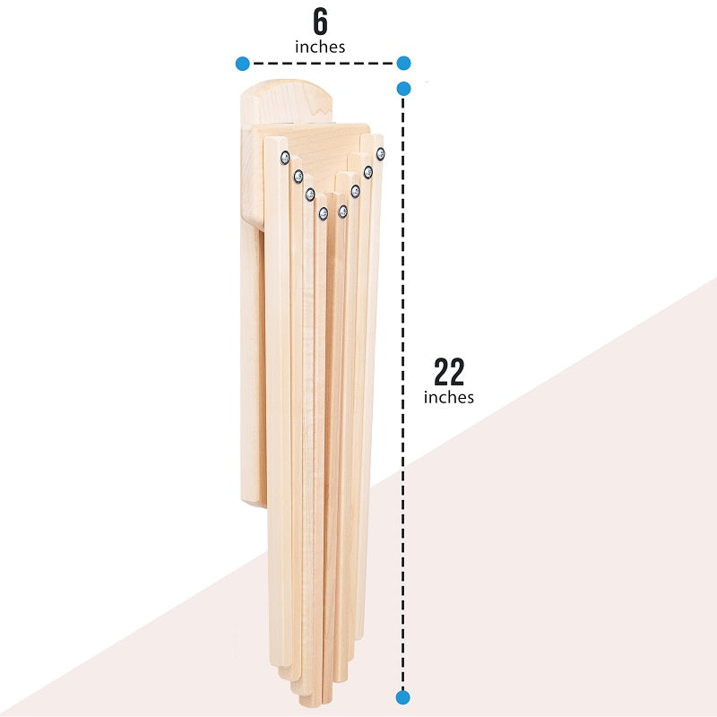 Fold down wall mounted clothes drying rack made of maple hardwood with clothes drying on it