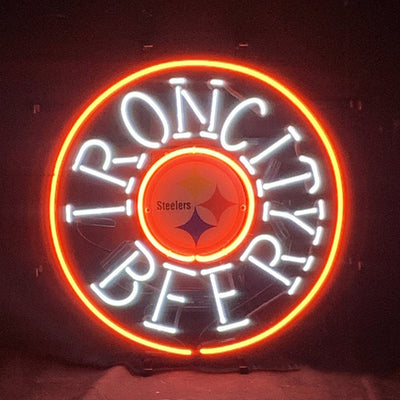 Iron City Beer Pittsburgh Steelers Neon Sign Light hanging against a neutral wall, illuminated with bright neon tubing.