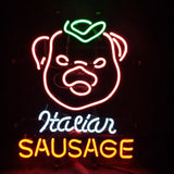 Neon sign displaying a pig's face in red with a green leaf on its head, above white cursive text 'Italian' and yellow block text 'SAUSAGE'.