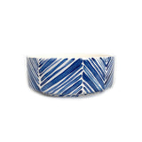 Wide ceramic serving bowl decorated with blue palm leaf patterns on a white background, shown from the side against a white backdrop.