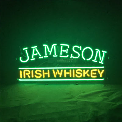Jameson Irish Whiskey Neon Sign with glowing green and white tubes on a metal grid backing