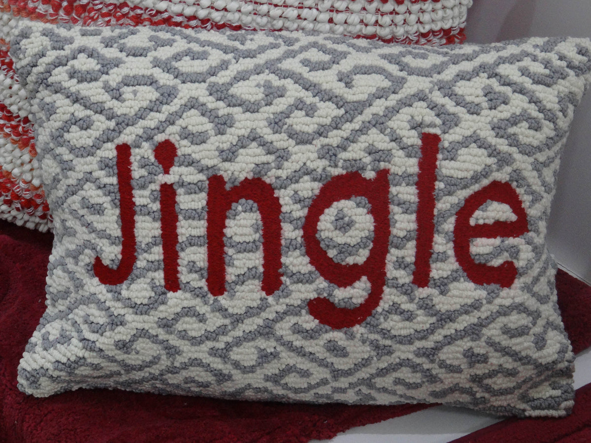 Rectangular cushion with gray and white geometric pattern background and the word 'Jingle' in large red letters across the center.