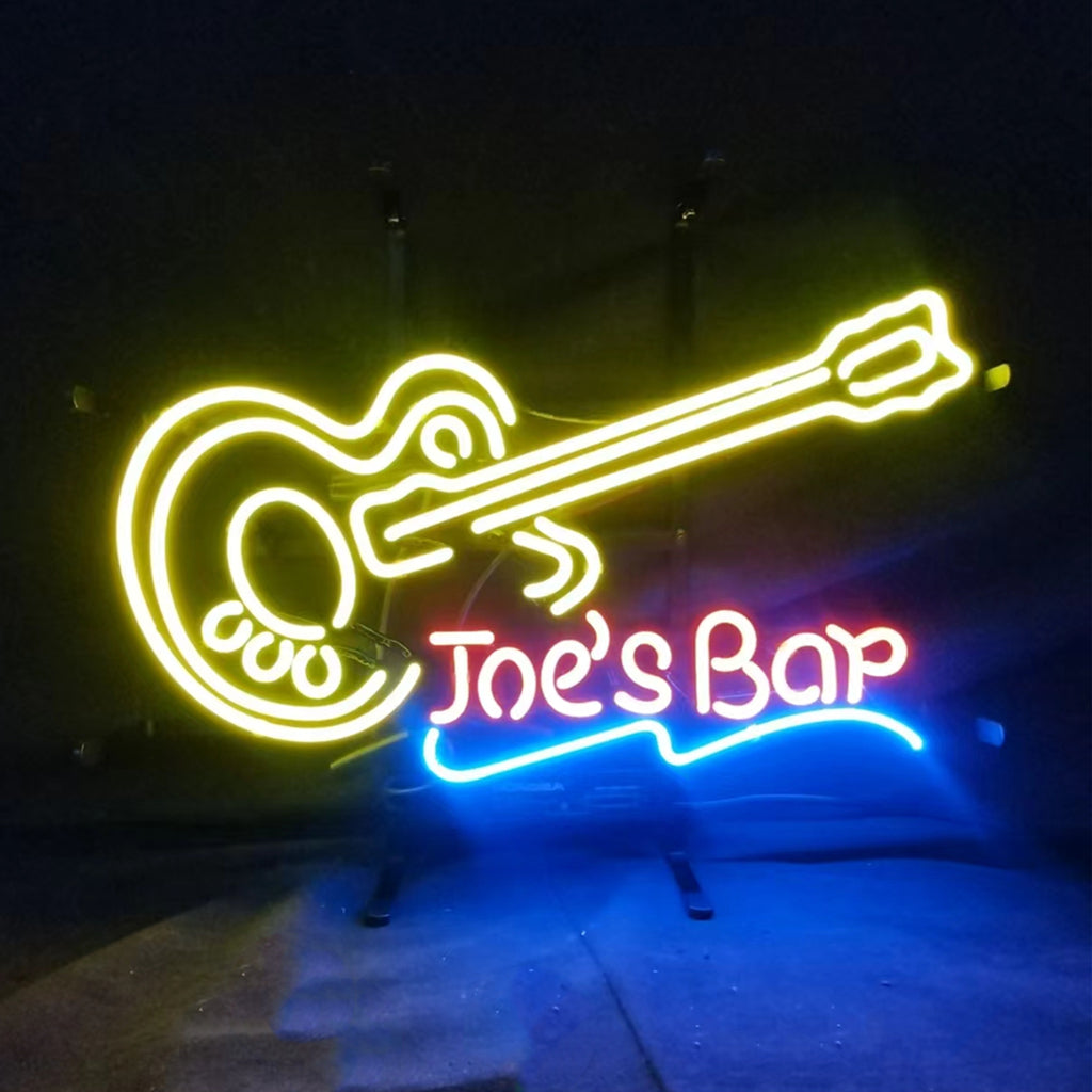 Joe's Bar Guitar Neon Signs Light glowing in a dim indoor setting