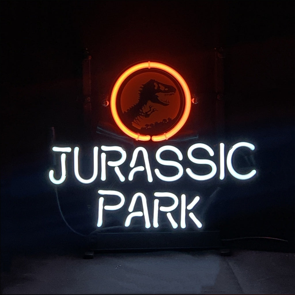 Neon sign with a red circle enclosing a black T-Rex silhouette above white glowing text spelling 'JURASSIC PARK' against a dark background.
