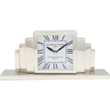 Rectangular table clock with nickel-plated steel body and black-and-white dial resting on a wooden surface