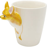 Cream-colored ceramic mug with a sculpted yellow and white dog head extending outward and painted dog legs on the side near the handle area.