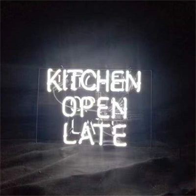 Kitchen Open Late Neon Sign glowing against a dark wall