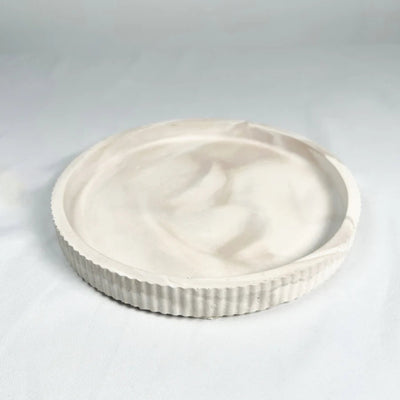 Fluted round resin stoneware tray in Limestone and Mocha Stone colors