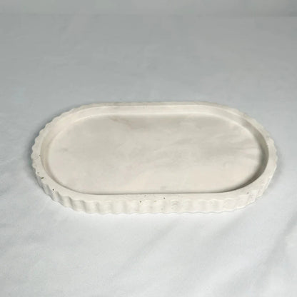 White ceramic oval platter on a gray background