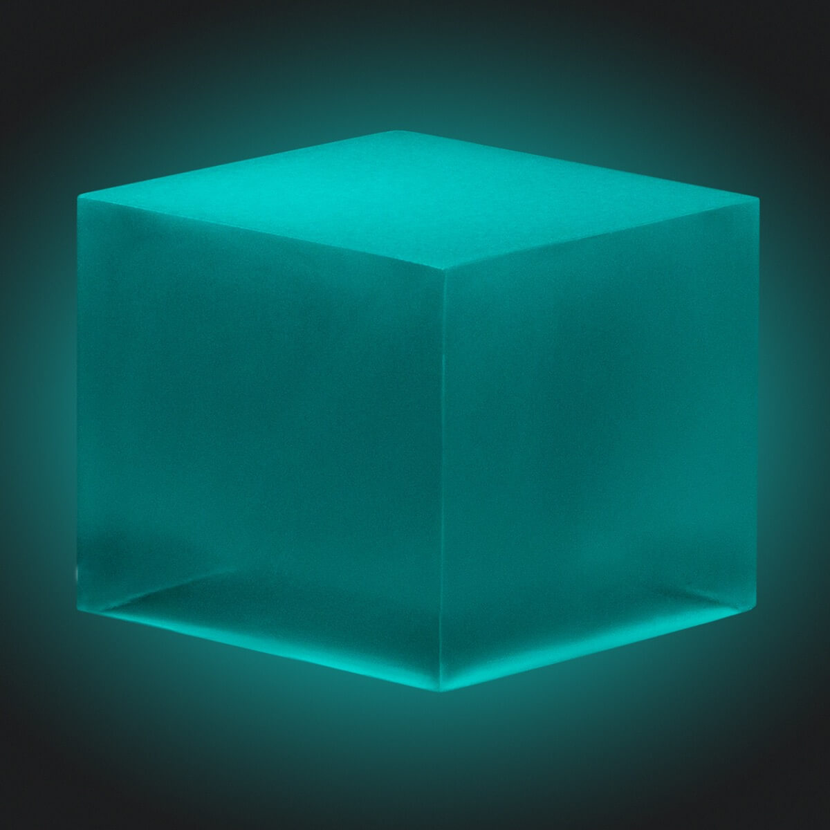 Glowing teal cube on a dark background