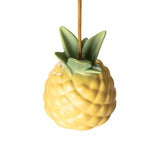 Yellow ceramic pineapple-shaped ceiling lamp with green ceramic leaves and a golden hanging cord against a white background.