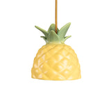 Yellow pineapple-shaped ceiling lamp shade with textured diamond pattern and green leaves top attached to a yellow cord.