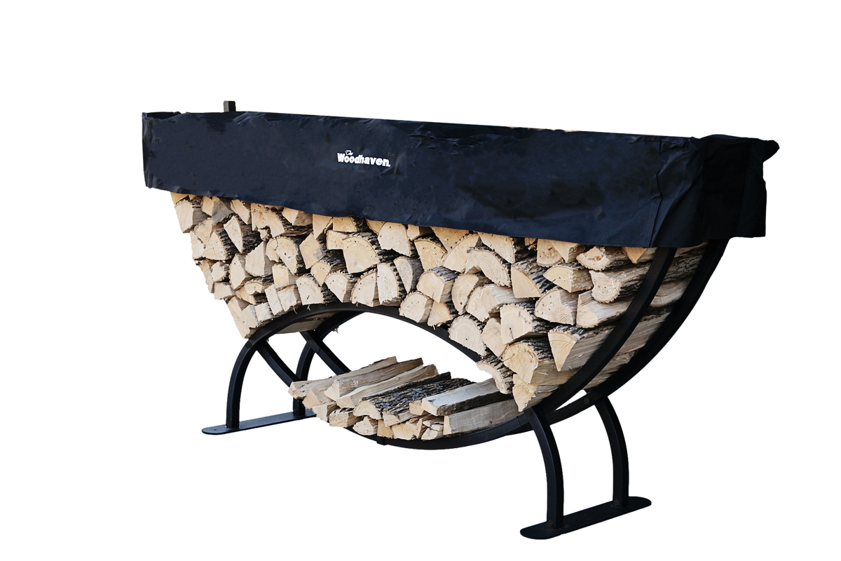 Woodhaven 8 ft Large Crescent Firewood Rack with seasoning cover holding firewood outside a house