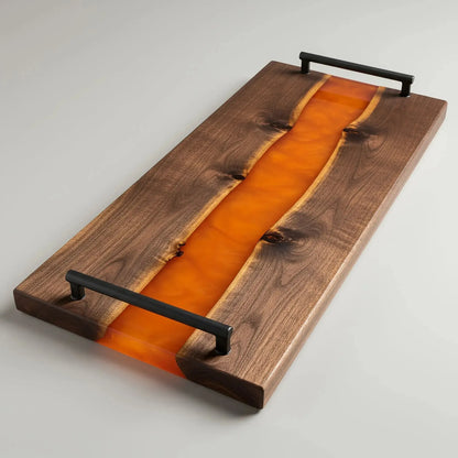 charcuterie board, 18 inches by 9 inches, made from live edge black walnut wood with a deep, glossy orange epoxy river flowing through the center. The resin has a rich, translucent amber or burnt orange tone that contrasts beautifully with the dark walnut grain. The board features a smooth, polished finish and matte black metal handles at each end.