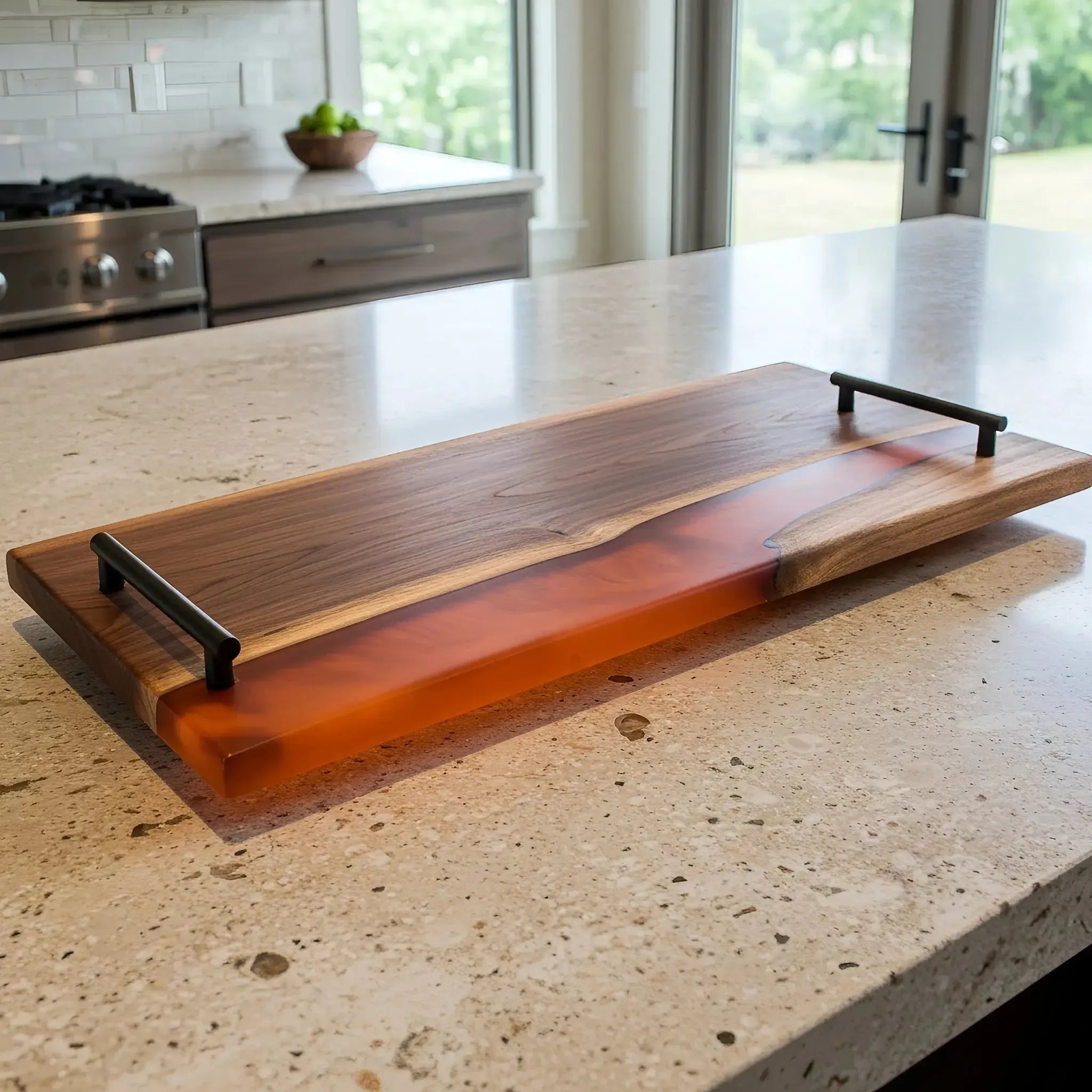 charcuterie board, 18 inches by 9 inches, made from live edge black walnut wood with a matte burnt orange epoxy river running through the center. The resin is warm and earthy—like amber or terracotta—with a subtle, non-glossy finish and soft texture. Matte black metal handles are attached at each end with a top bar that extends slightly past the posts.