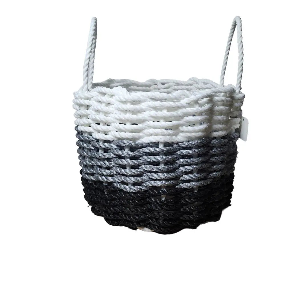 Handmade lobster rope storage basket in black, gray, and white ombre colors