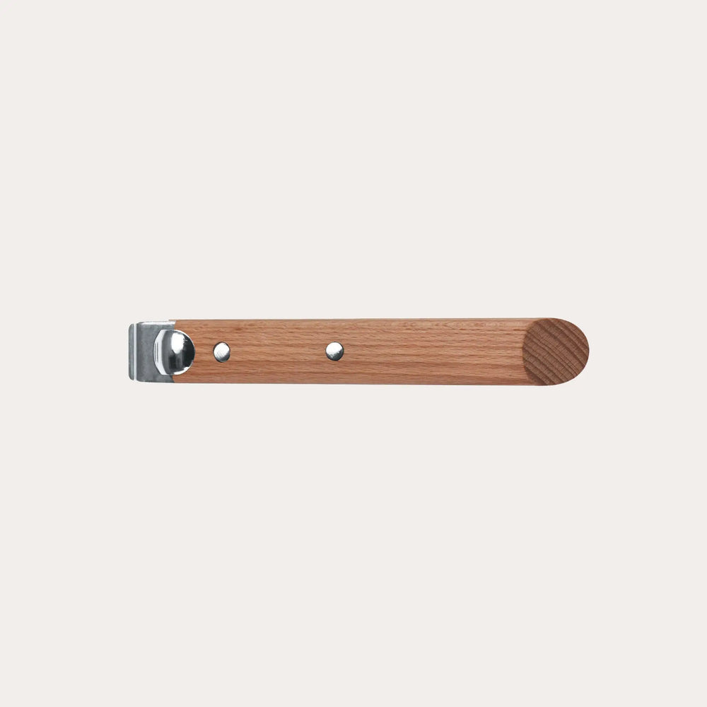 Wood Long Handle in walnut finish attached to CRISTEL cookware on kitchen countertop