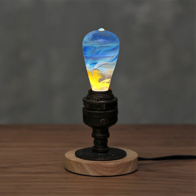 EP Light Fire Decorative Resin LED Bulb with glowing fire effect inside, shown with wooden base options