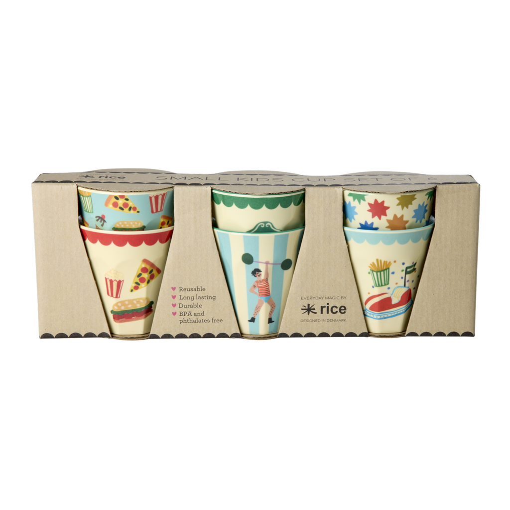Six small melamine kids cups with blue and mint fun fair prints arranged in a gift box