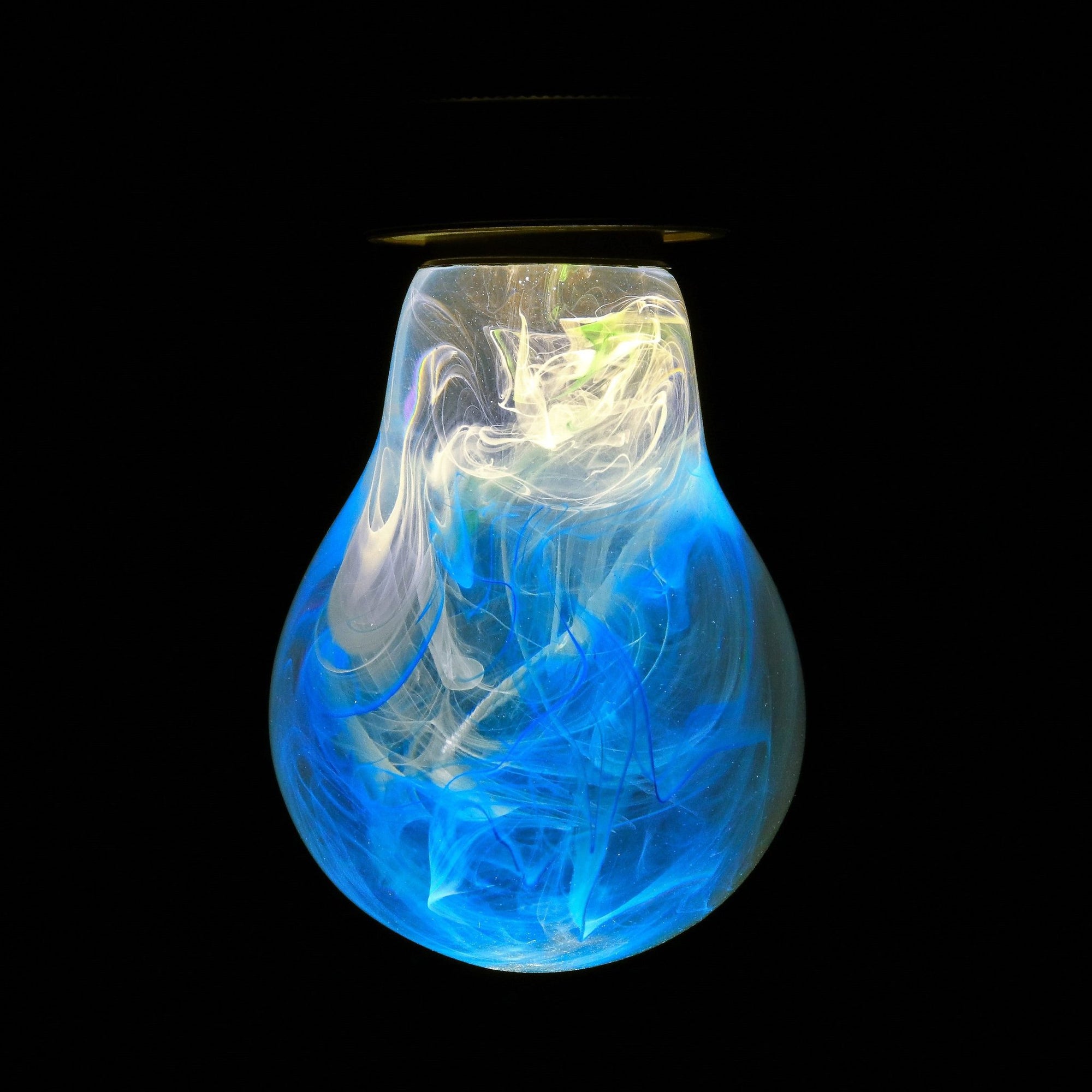 EP Light Memory Resin LED Bulb handcrafted with eco-friendly resin, shown with wooden base options