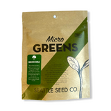 Brown kraft paper pouch with diagonal green stripe, labeled 'Micro Greens' and 'Broccoli,' featuring a simple seedling illustration and Seattle Seed Co. branding.