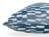 Rectangular velvet pillow cover in marine blue with an abstract white geometric pattern, shown from the side with a visible zipper closure.