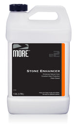 One-gallon white plastic jug with black label and orange stripe containing MORE® Stone Enhancer, a water-based natural color enhancer and stain protector.