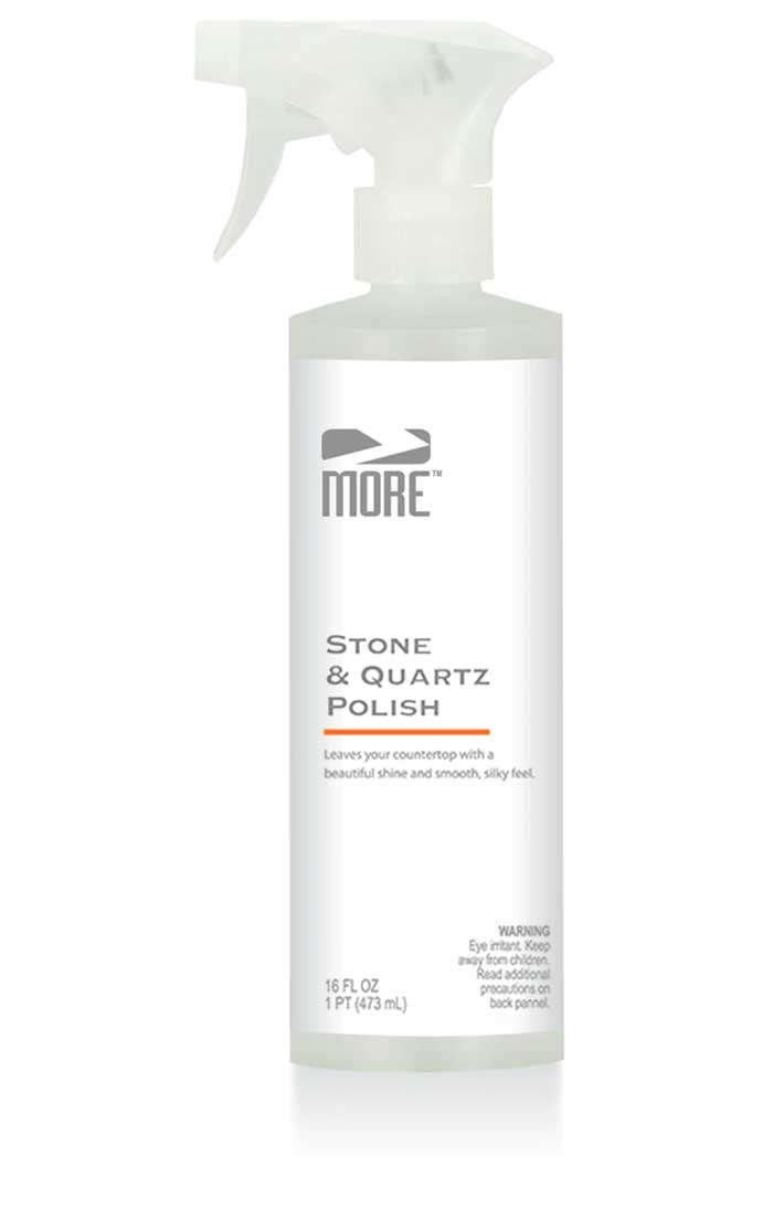 Bottle of MORE® Stone & Quartz Polish in front of a clean polished stone surface