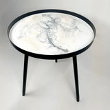 Resin Art Side Table with black metal frame and glossy resin-coated acacia wood tabletop in Northern Lights color