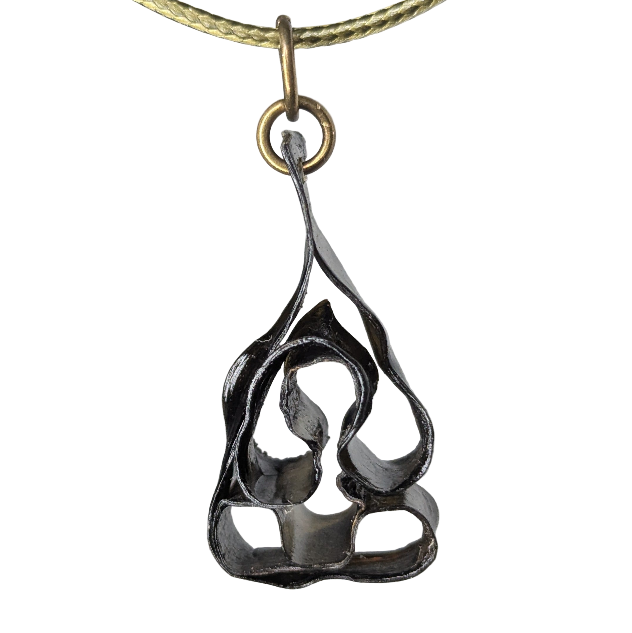 Macrya pendant necklace by Versiliy displayed on a white surface, showing organic shape and natural earthy tones