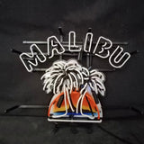 Neon sign with white 'MALIBU' text above two white palm trees and a sunset shaped in orange, yellow, and blue neon lights against a black background.