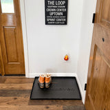 Woodhaven Multi-Purpose Firewood Rack Mat showing raised edges and waterproof surface
