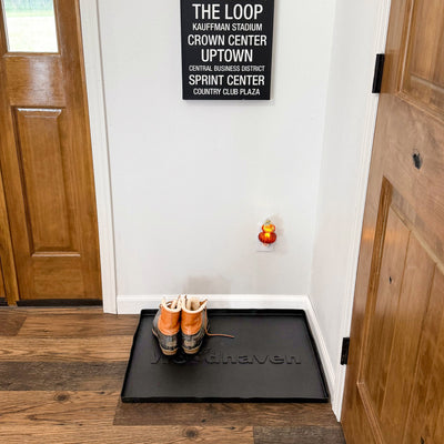 Woodhaven Multi-Purpose Firewood Rack Mat showing raised edges and waterproof surface
