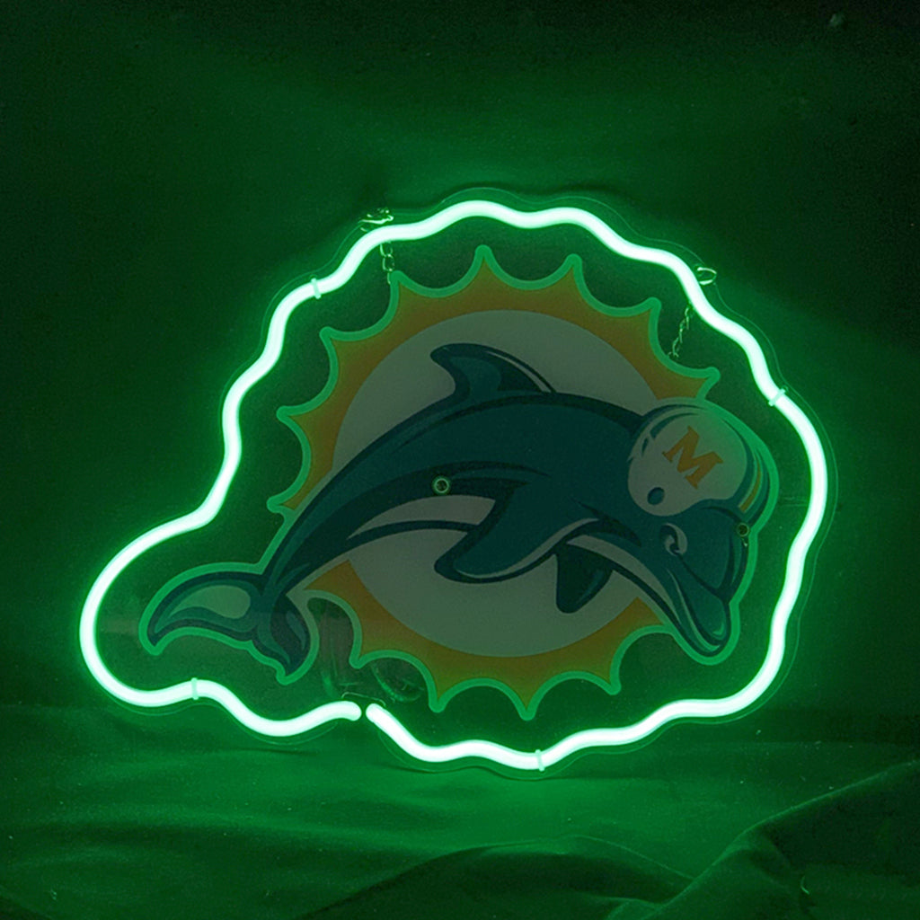 Miami Dolphins logo showing a teal dolphin wearing a white helmet with an orange M, set against an orange sunburst, outlined by a glowing green neon light.