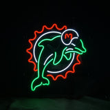 Neon sign of a green dolphin wearing a white helmet with an orange 'M,' encircled by a white ring and an orange sunburst pattern.