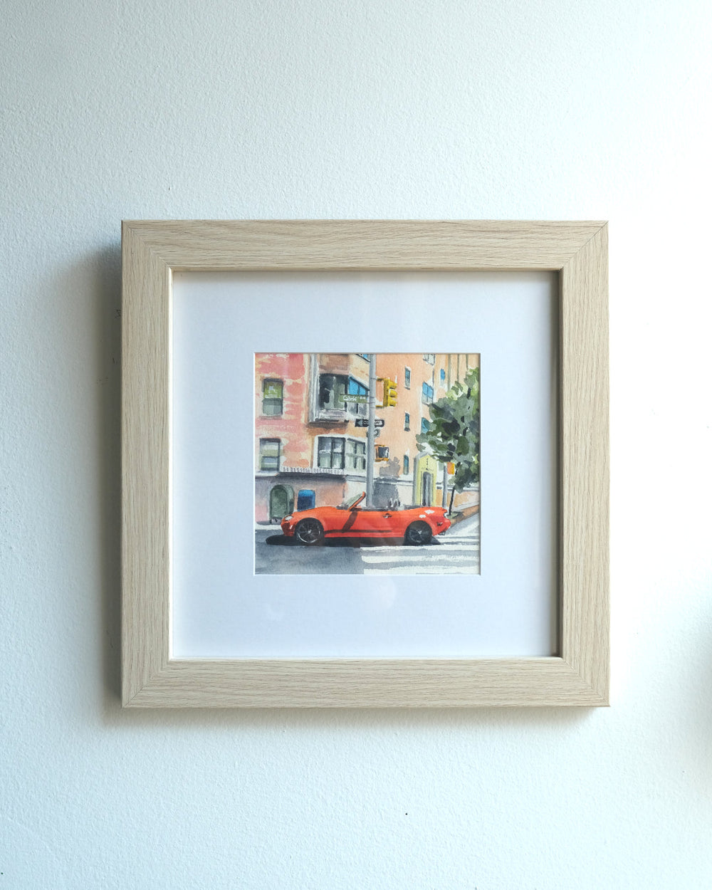 Watercolor painting of a bright red Mazda Miata parked in a crosswalk in New York City
