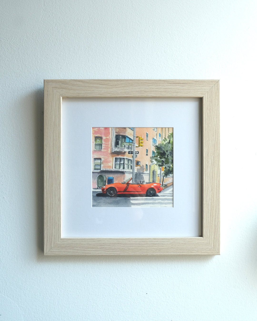 Watercolor painting of a bright red Mazda Miata parked in a crosswalk in New York City