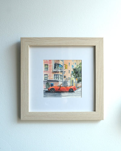 Watercolor painting of a bright red Mazda Miata parked in a crosswalk in New York City