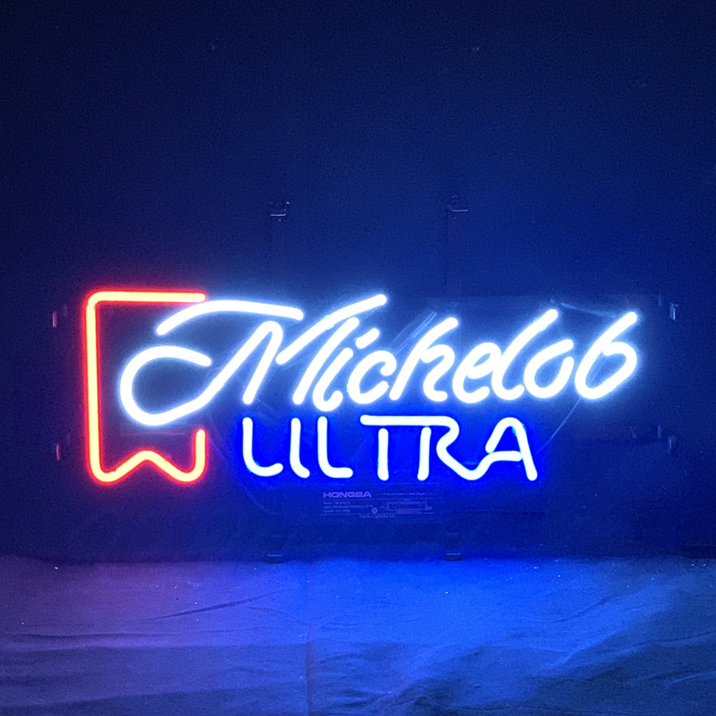Michelob Ultra Neon Sign Light glowing indoors with metal grid backing