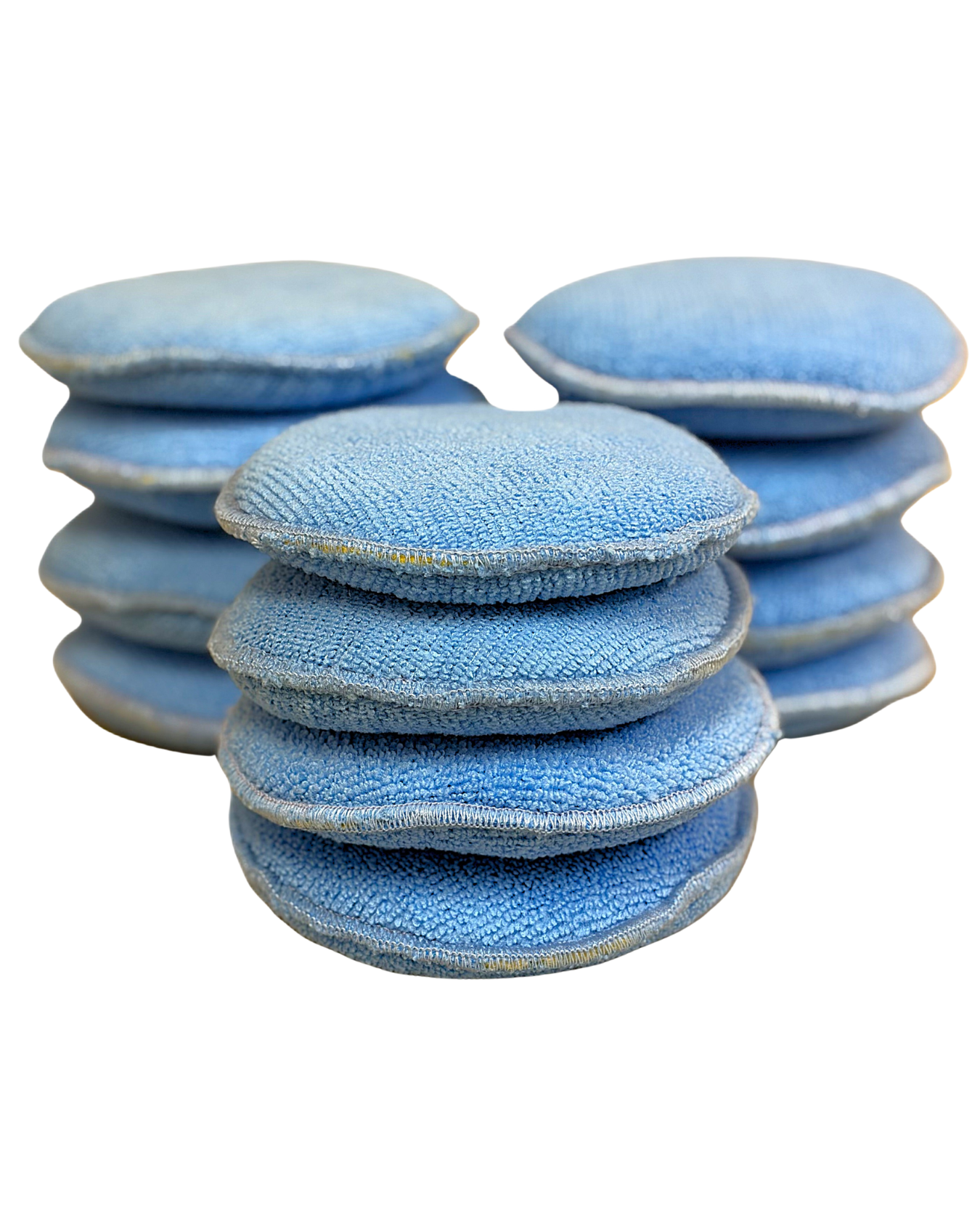 Twelve 5-inch diameter microfiber applicators arranged for display