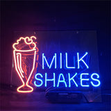 Milk Shakes neon light sign glowing pink, mounted on an acrylic backing with hanging chain.