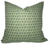 Green Mimi Floral Pillow Cover displayed on a couch showing floral front and ivory linen back.