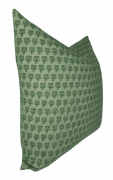 Green square pillow cover featuring a repeating small dark green floral motif arranged in rows, displayed at a slight angled side view.