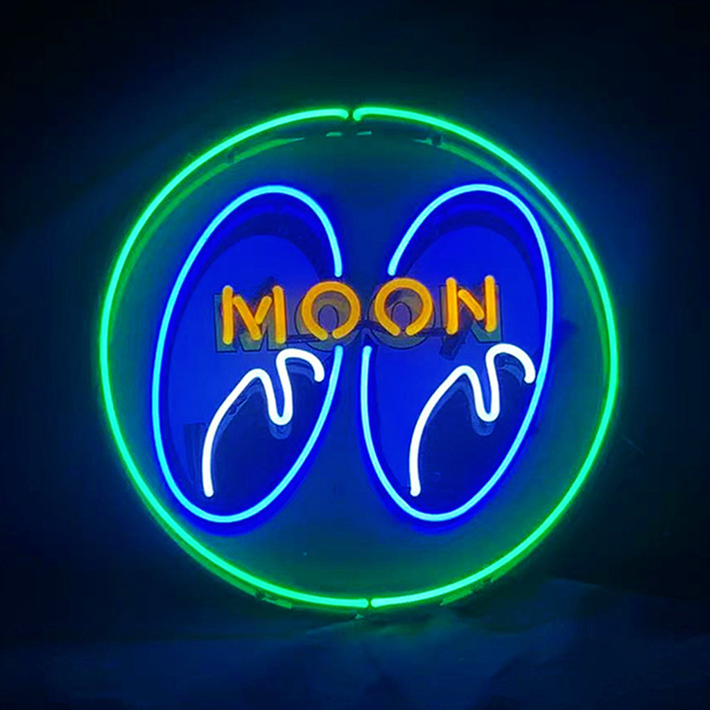 Circular neon sign with bright green outer ring, blue inner shapes resembling stylized eyes, white highlights, and yellow-orange uppercase text reading MOON.