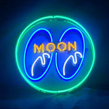 Moon Eyes Neon Signs Green illuminated on a wall, showing a glowing neon design with green light against acrylic or metal backing