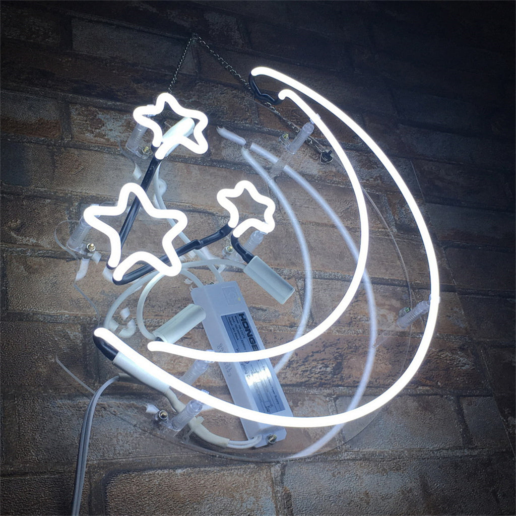 White neon light sign shaped like a crescent moon with three stars, mounted on a clear circular background against a brick wall.