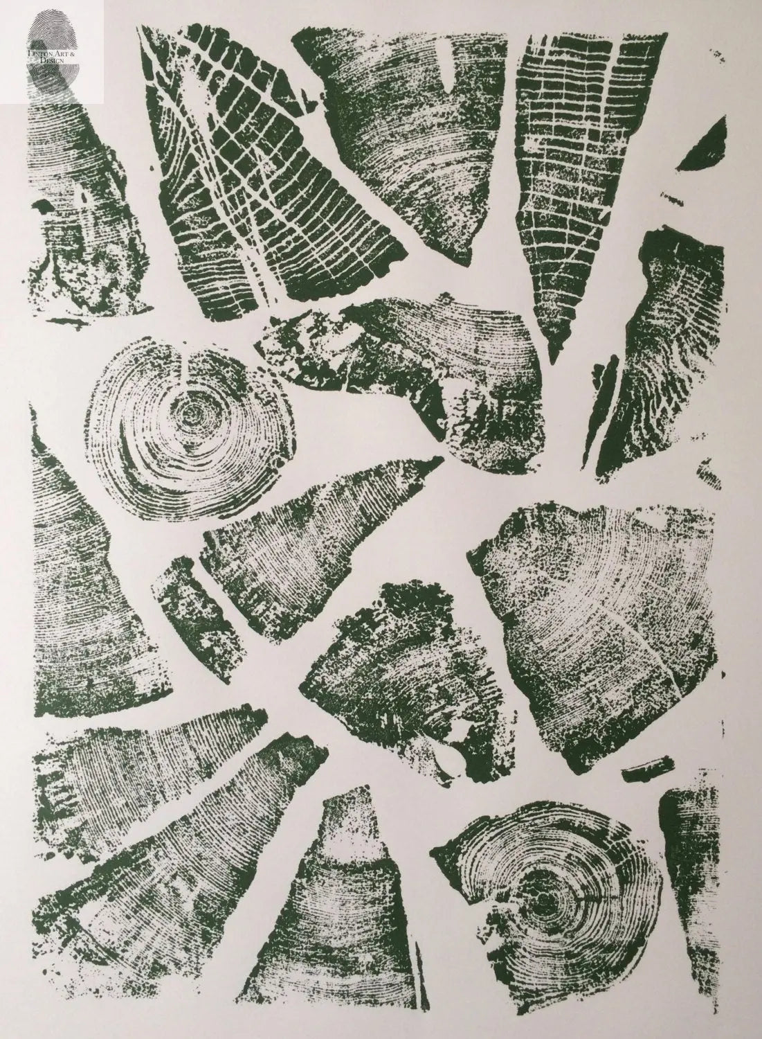 Collage of black wood grain and tree ring prints on white background forming varied natural patterns in different shapes and sizes.